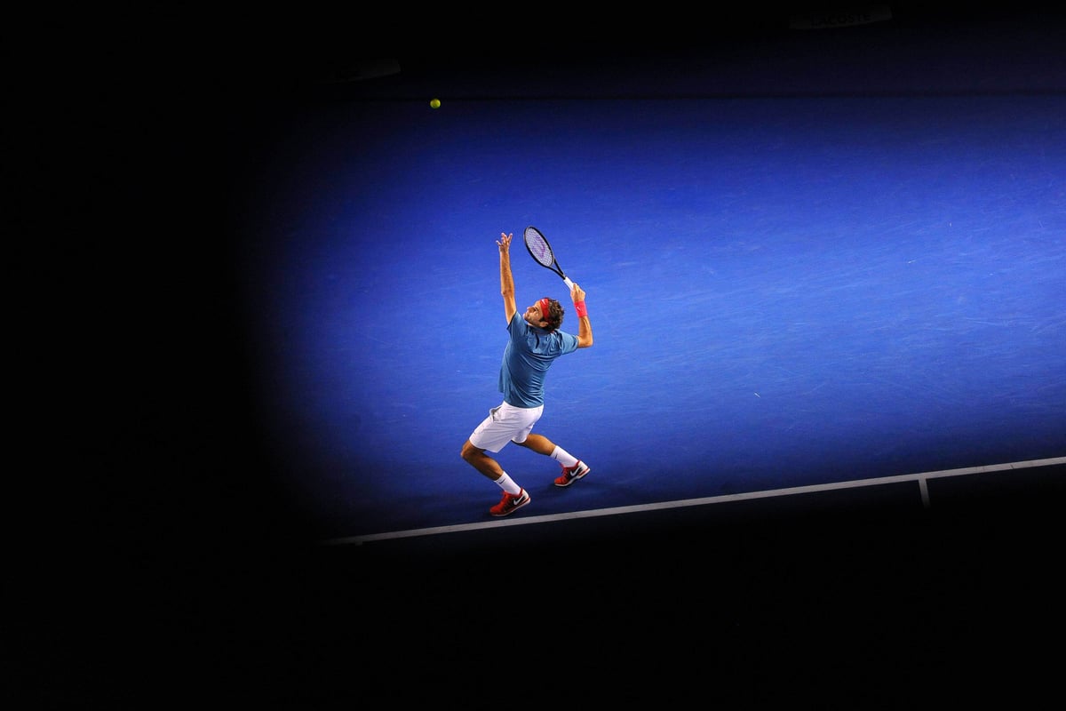 Roger Federer serves