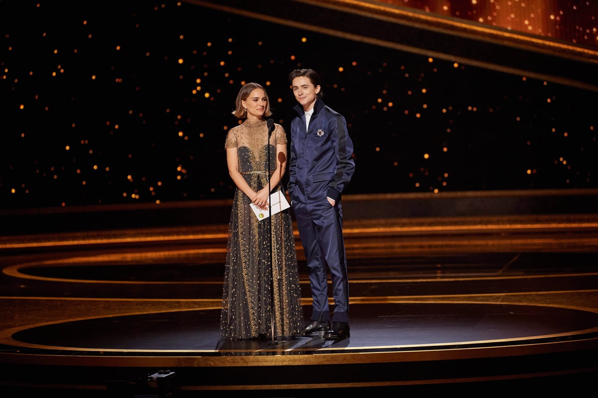 Natalie Portman and Timothee Chalamet present the Oscar for Adapted Screenplay during the live ABC Telecast of The 92nd Oscars at the Dolby Theatre in Hollywood. 