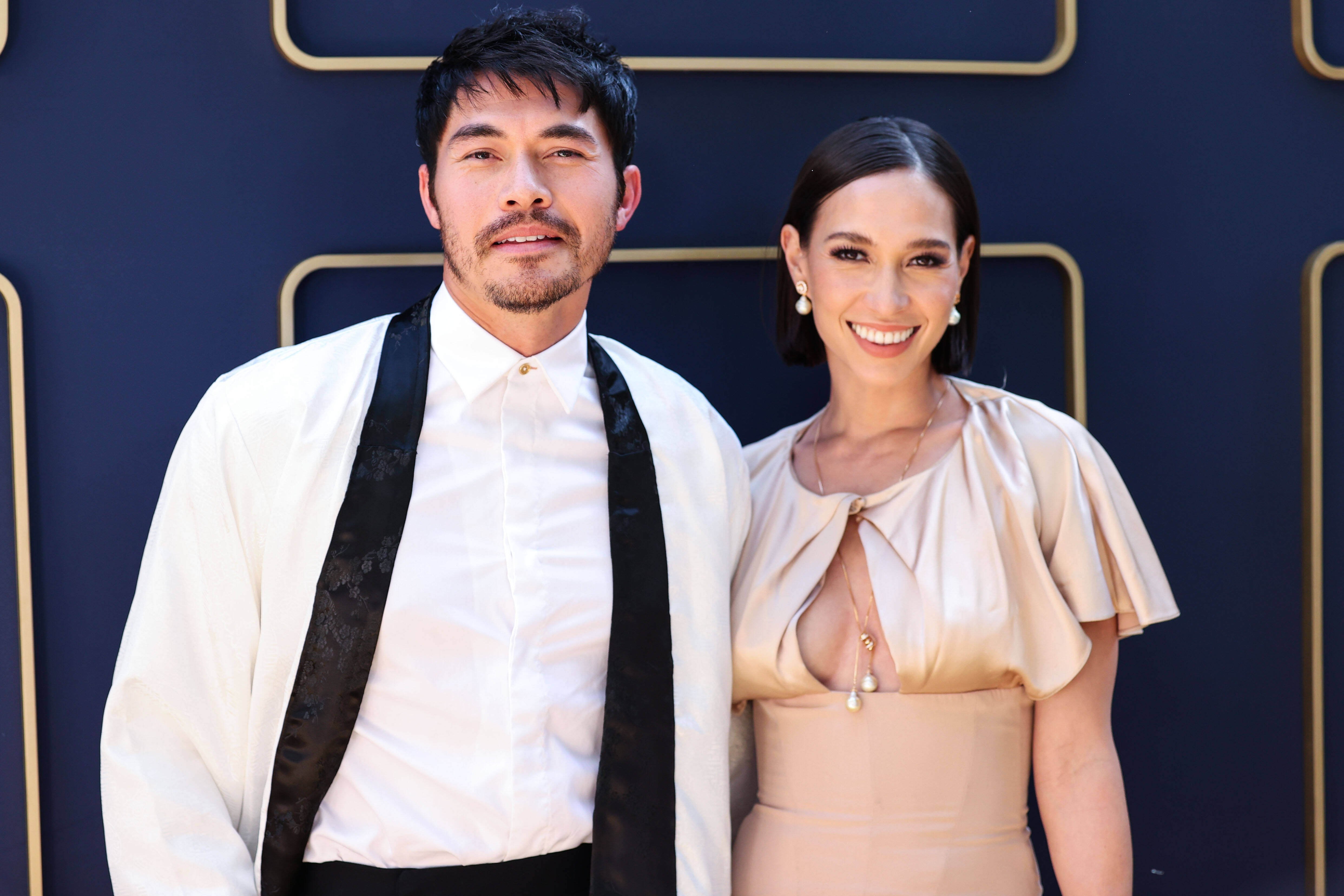 The New Gold Age Henry Golding and Liv Lo arrive at Gold House s Inaugural Gold Gala 2022.
