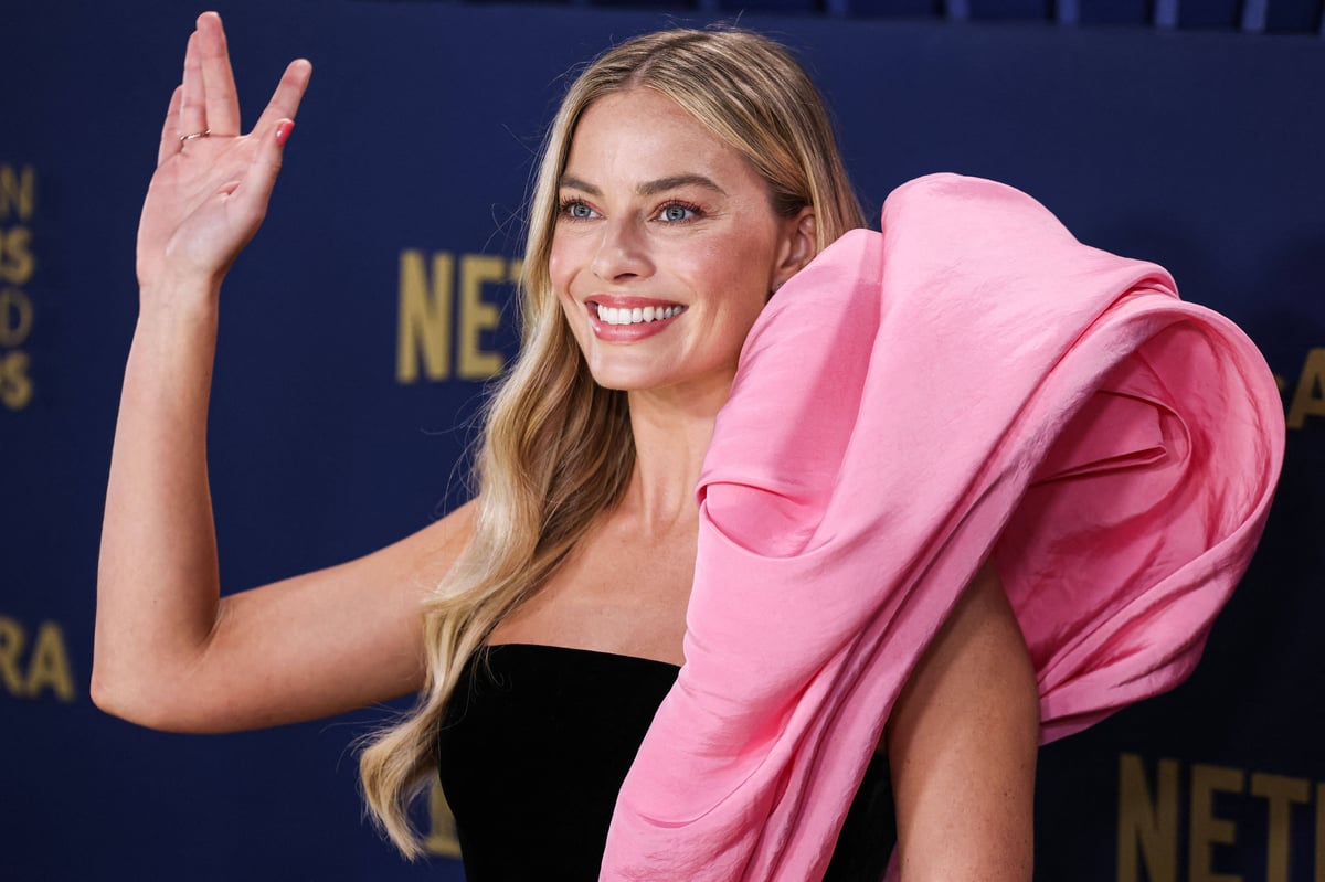 Margot Robbie wearing Schiaparelli FW20 Couture arrives at the 30th Annual Screen Actors Guild Awards held at the Shrine Auditorium and Expo Hall.