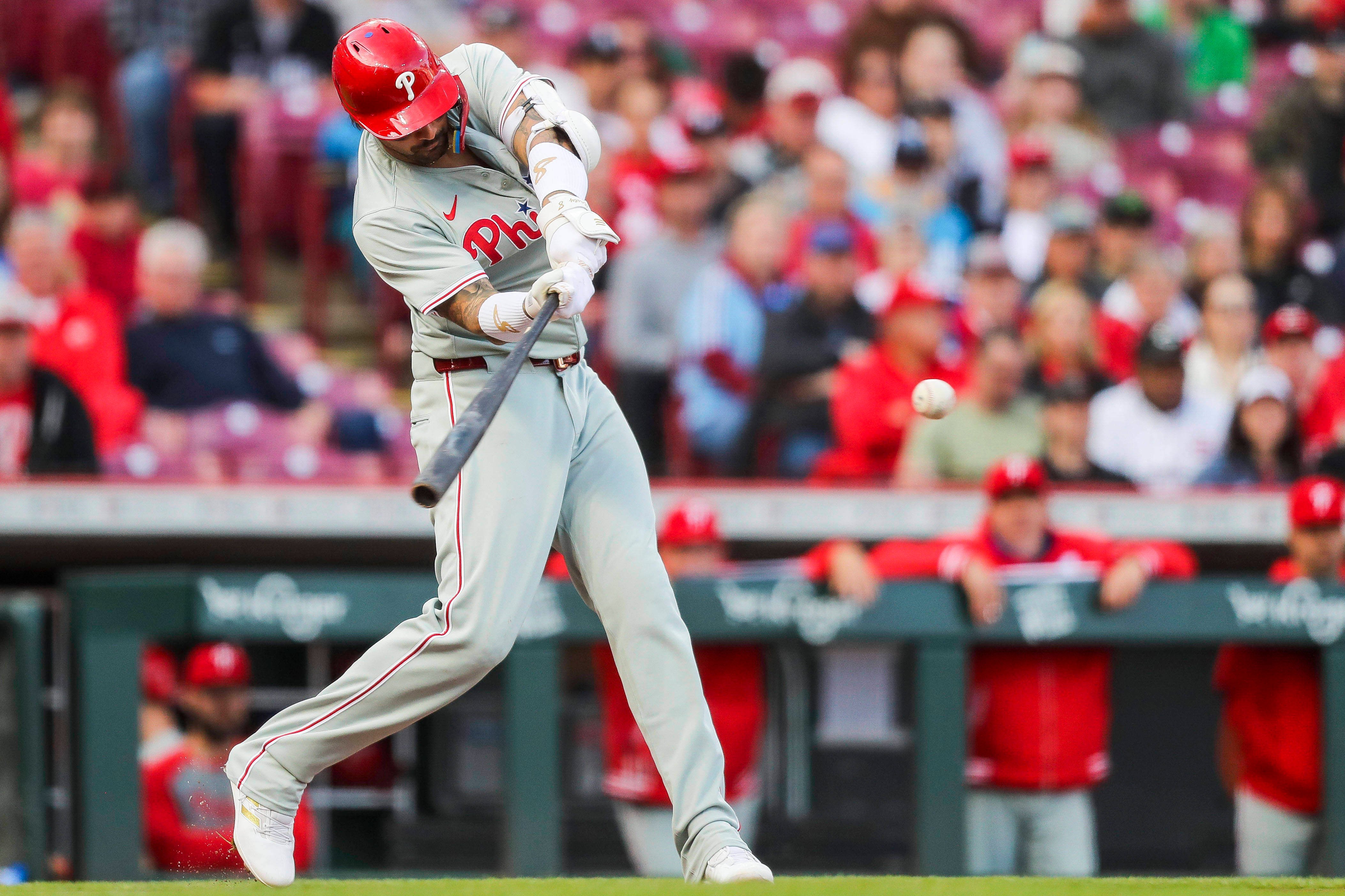  Phillies outfielder Nick Castellanos (8) hits a single against the Cincinnati Reds in the second inning at Great American Ball Park.