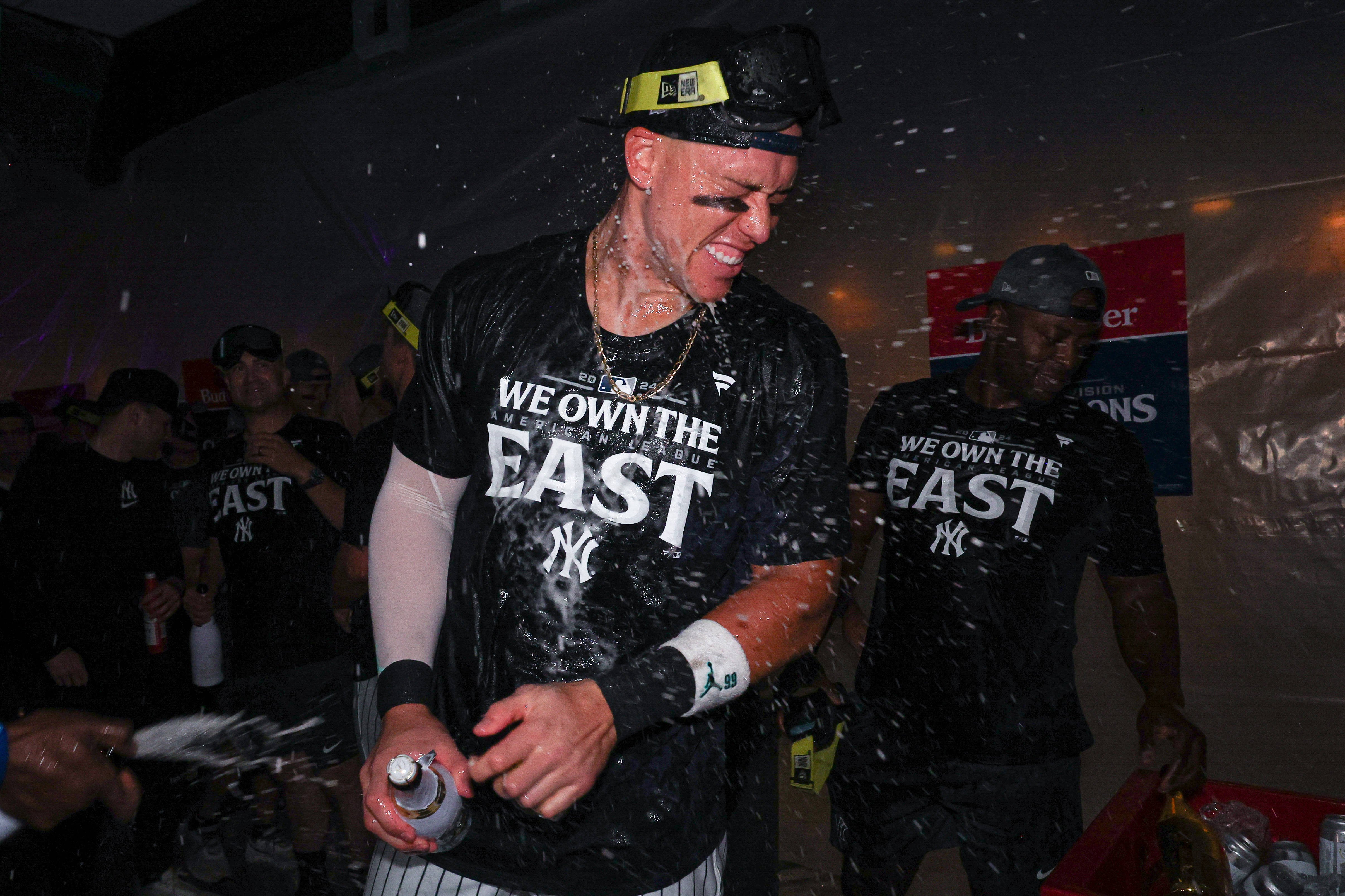 New York Yankees center fielder Aaron Judge (99) celebrates after defeating the Baltimore Orioles to clinch the American League East title at Yankee Stadium.