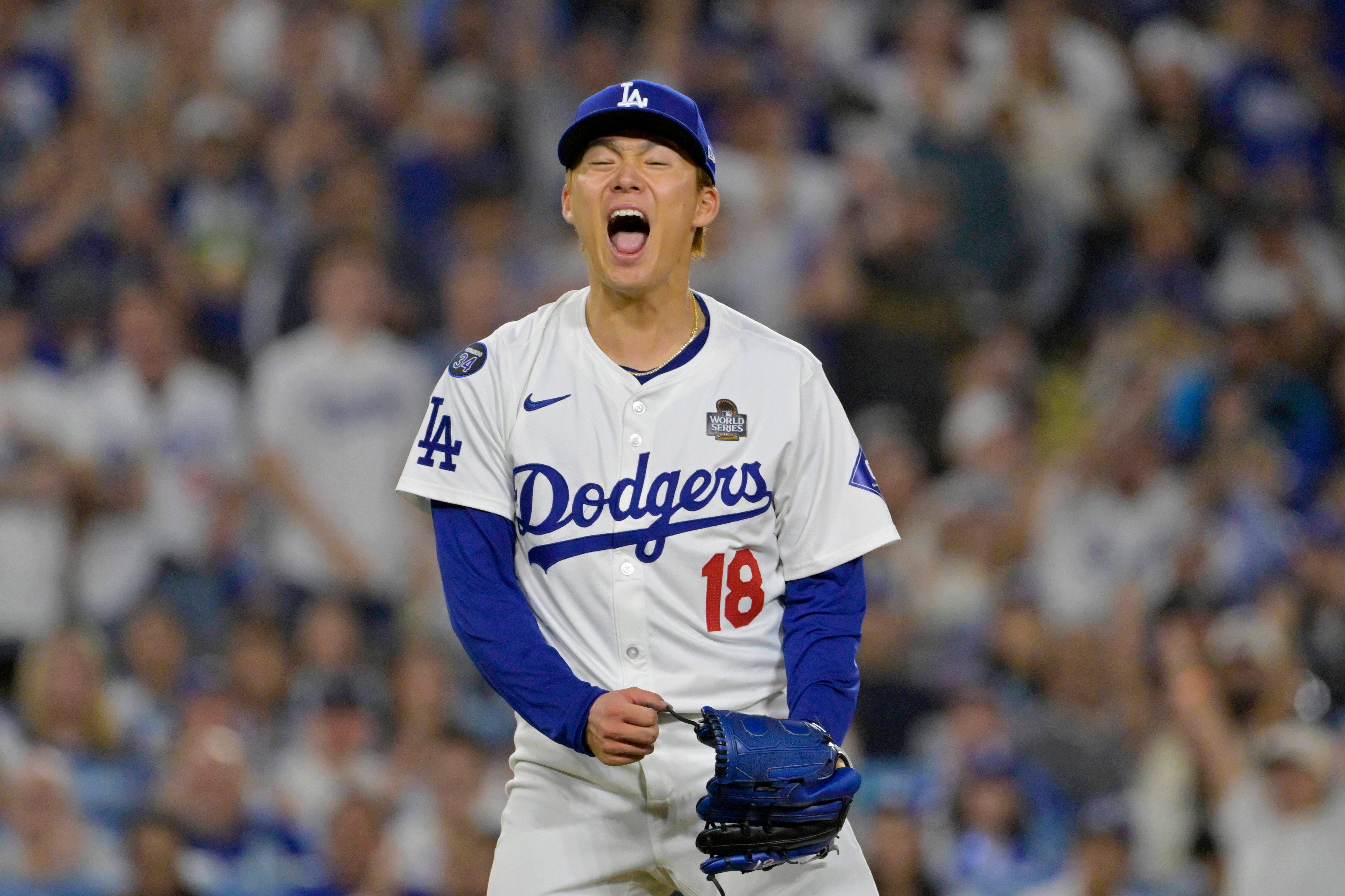 Los Angeles Dodgers pitcher Yoshinobu Yamamoto (18) reacts in the fourth inning against the New York Yankees.