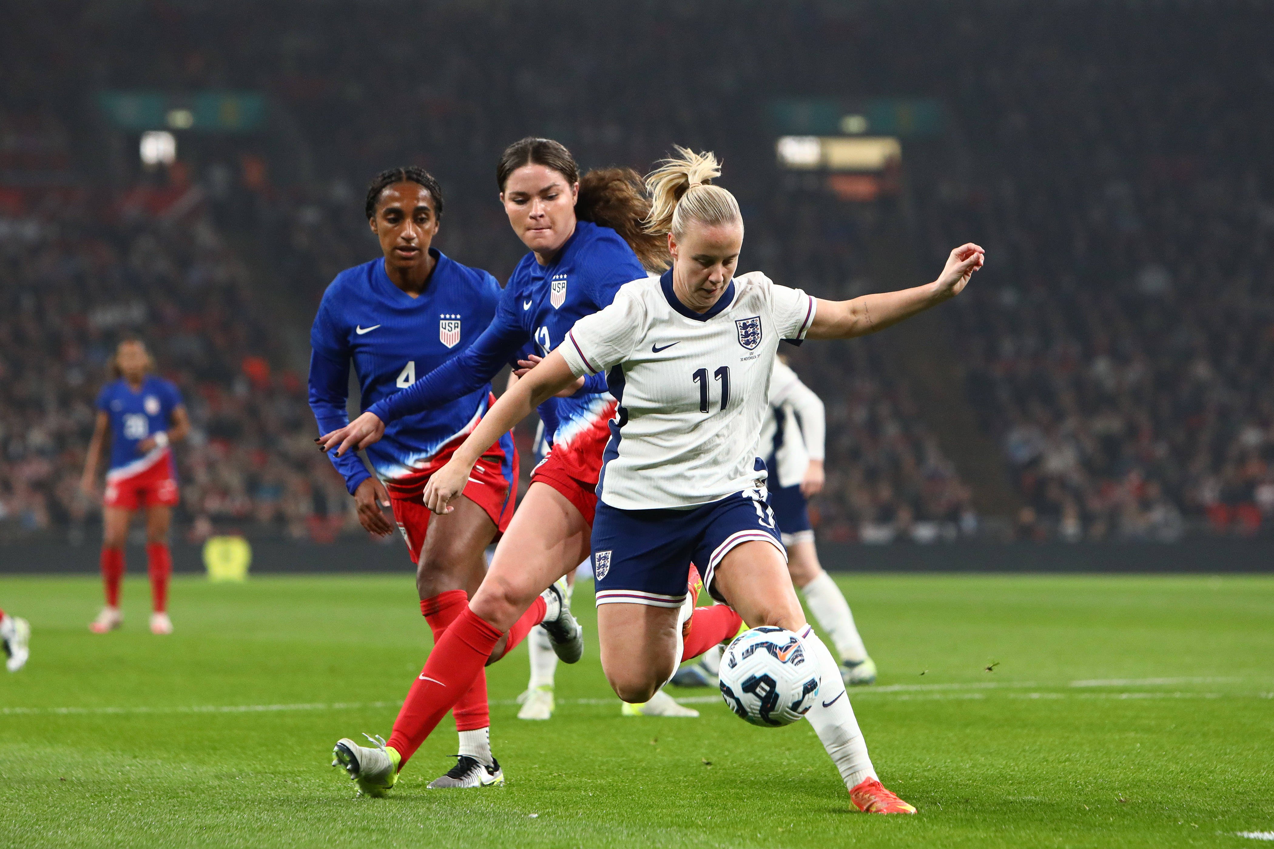 Photo of Beth Mead (11 England) defends the ball from Emma Sears