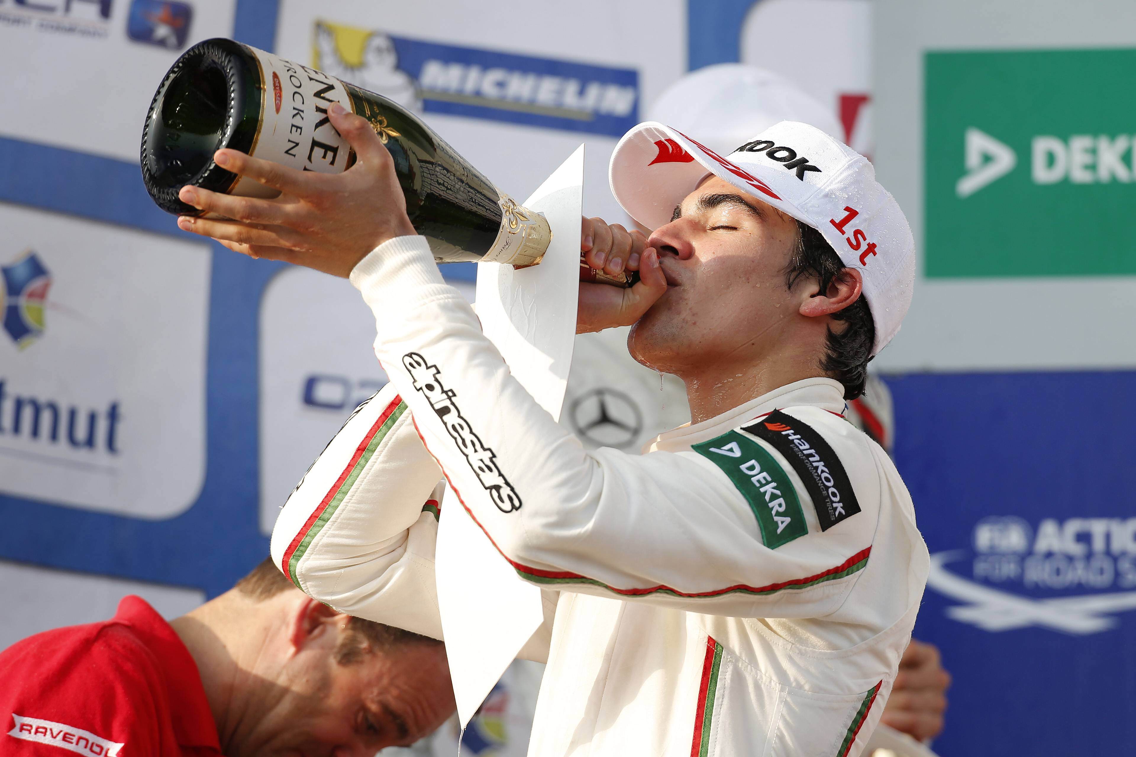 Lance Stroll celebrates the prize giving ceremony.