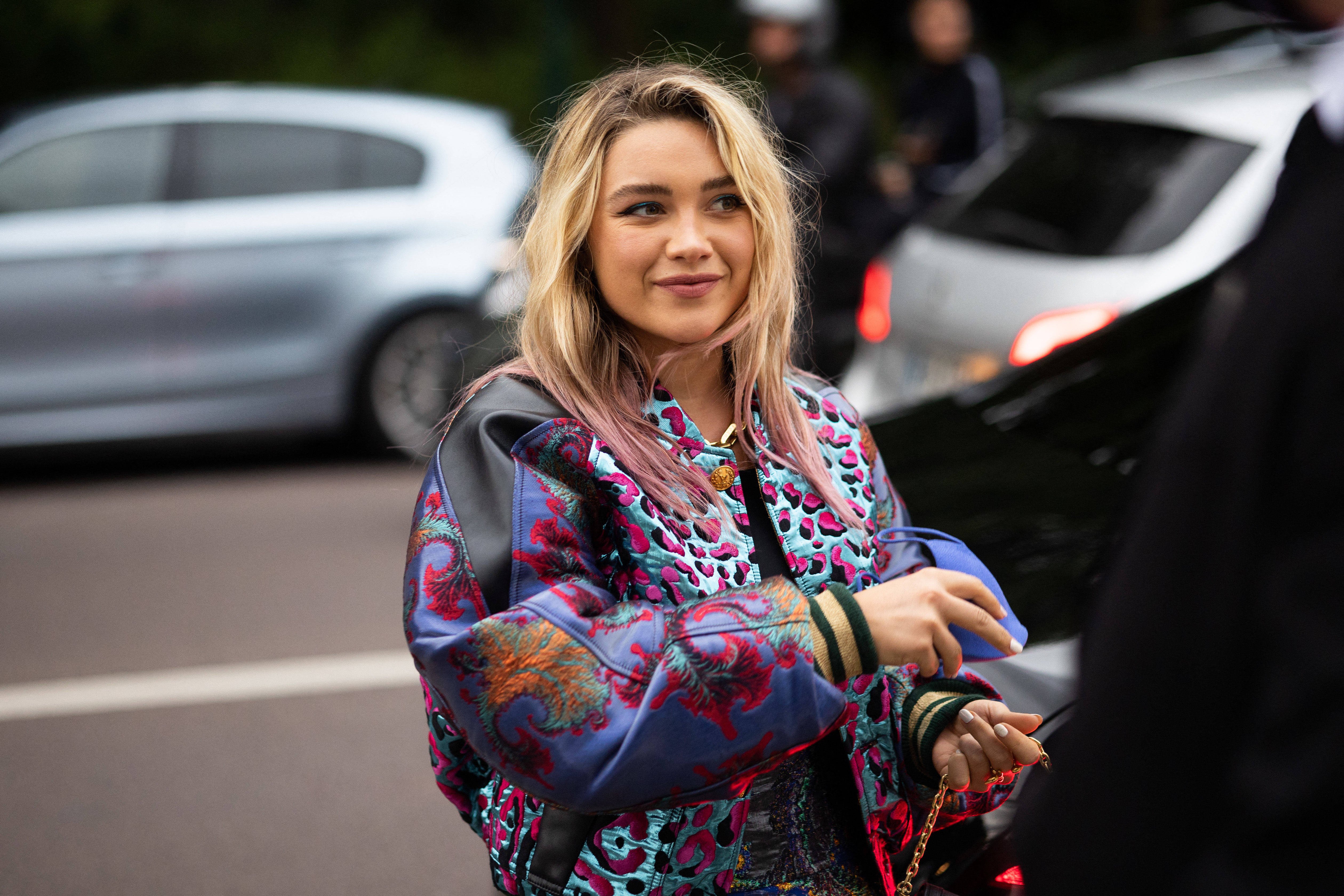 British actress Florence Pugh poses for a picture as she arrives for a dinner at the Louis Vuitton Foundation in Paris.